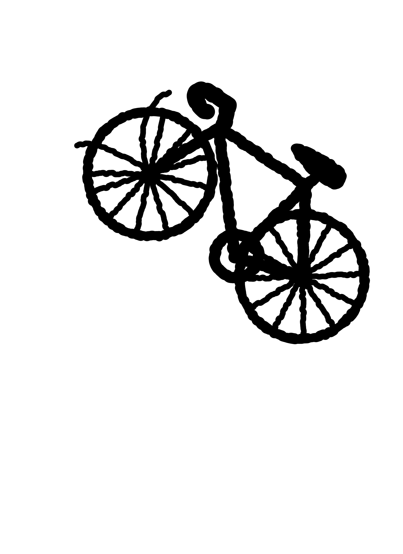 A riderless bicycle tipped over at an angle.